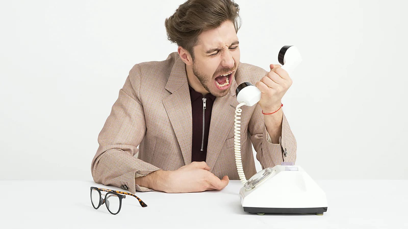Australian business owner comparing missed call text-back software on a phone