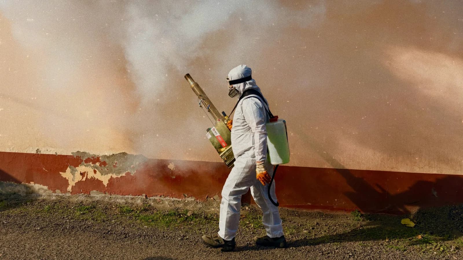 A pest control technician on a job site